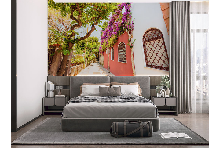 Фотообои «Дорога по улице старинного цветущего города» в интерьере