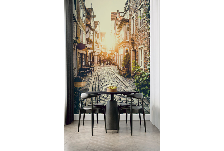 Фотообои «Улица с кафе в лучах заката» в интерьере