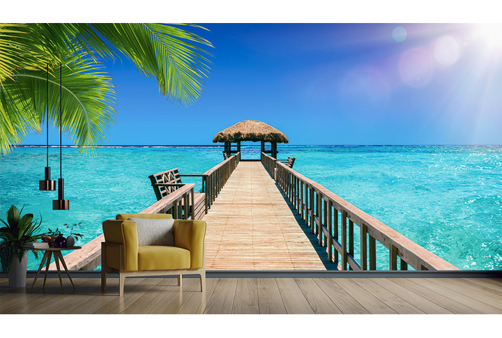 Фотообои «Морская панорама с пальмовыми листьями» в интерьере